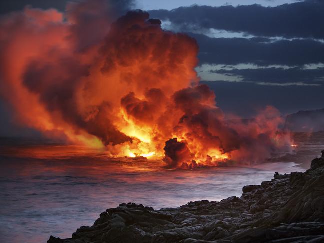 Photo by Grant Kaye / National Geographic Nature Photographer of the Year contest. Kamokuna ocean entry, November 2016 Lava flows into the ocean at sunset, kamokuna, Kalapana, hawaii