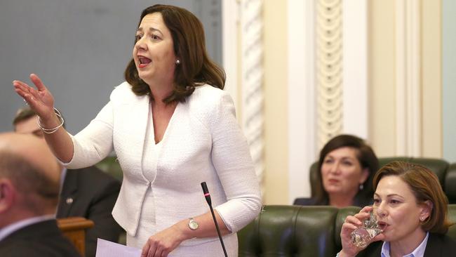 Queensland Premier Annastacia Palaszczuk (left) and Deputy Premier Jackie Trad during Question Time in Parliament House in Brisbane, Wednesday, August 21, 2019. (AAP Image/Jono Searle)