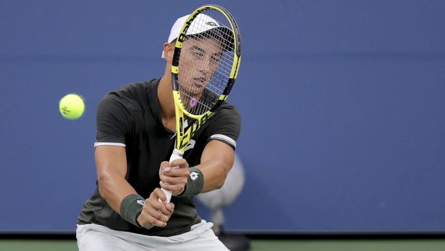 Antoine Hoang battles for a return against Nick Kyrgios. Picture: AP