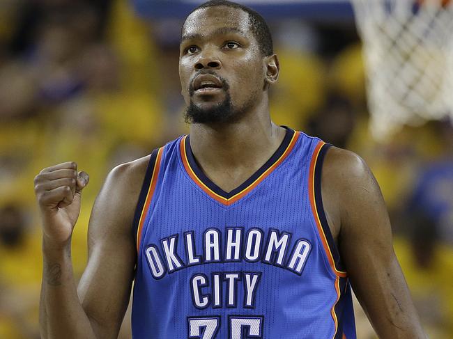 FILE - In a Monday, May 30, 2016 file photo, Oklahoma City Thunder forward Kevin Durant (35) reacts during the second half of Game 7 of the NBA basketball Western Conference finals against the Golden State Warriors in Oakland, Calif. Durant announced Monday, July 4, 2016, that he is joining All-Stars Stephen Curry and Klay Thompson with the Golden State Warriors. Durant made the decision public on The Playersâ€™ Tribune Monday morning. He canâ€™t officially sign until July 7. (AP Photo/Marcio Jose Sanchez, File)