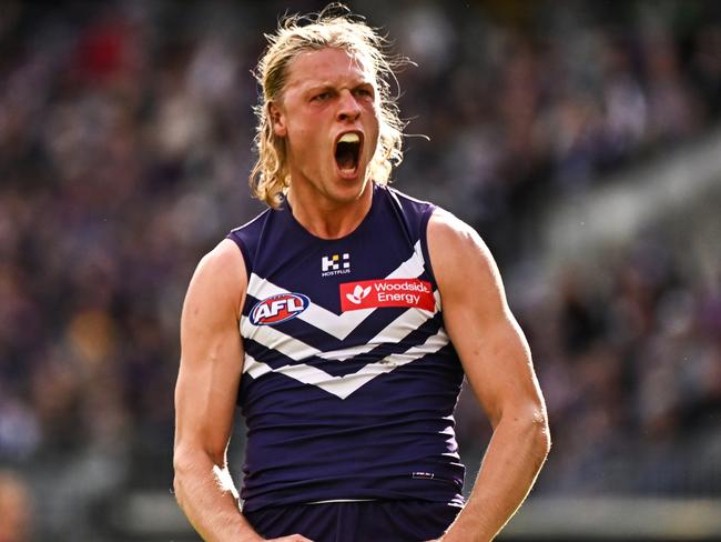 PERTH, AUSTRALIA - JUNE 23: Hayden Young of the Dockers celebrates a goal during the 2024 AFL Round 15 match between the Fremantle Dockers and the Gold Coast SUNS at Optus Stadium on June 23, 2024 in Perth, Australia. (Photo by Daniel Carson/AFL Photos via Getty Images)