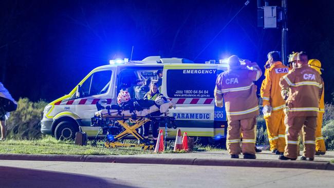 A person is treated by a paramedic. Picture: Jake Nowakowski