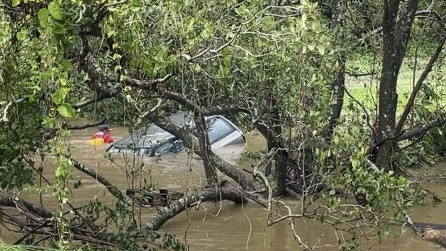 A 50-year-old man and his dog were found dead in a submerged car at Currumbin Valley after driving into flood waters. Picture: 7NEWS