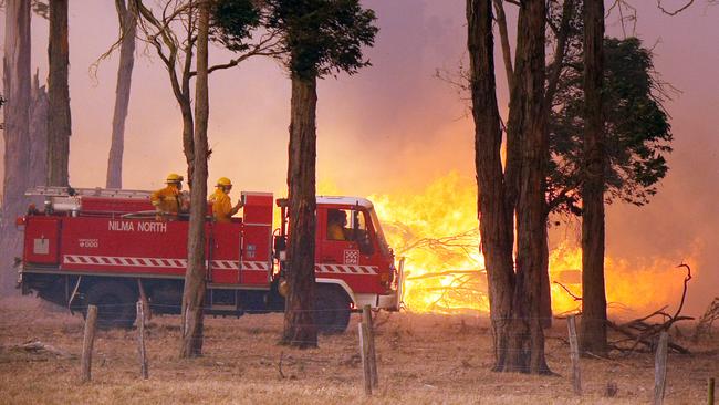 Firefighters battle blazes ahead of a cool change setting in with stronger winds.