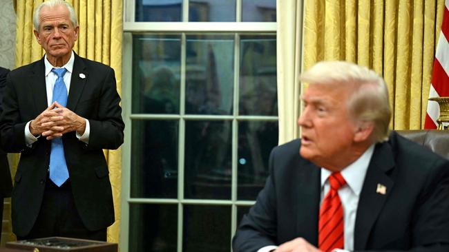 US President Donald Trump with Peter Navarro in the Oval Office of the White House. Picture: AFP.