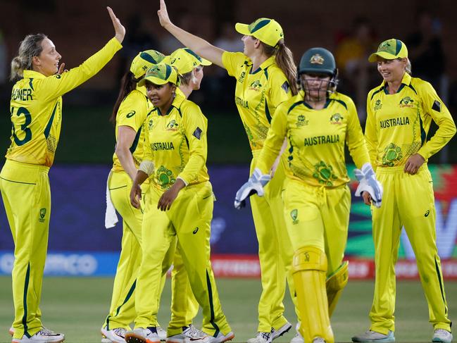 Australia's Ashleigh Gardner (L) celebrates with teammates after the dismissal of Bangladesh's Nigar Sultana Joty (not seen) during the Group A T20 women's World Cup cricket match between Australia and Bangladesh at St George's Park in Gqeberha on February 14, 2023. (Photo by Marco Longari / AFP)