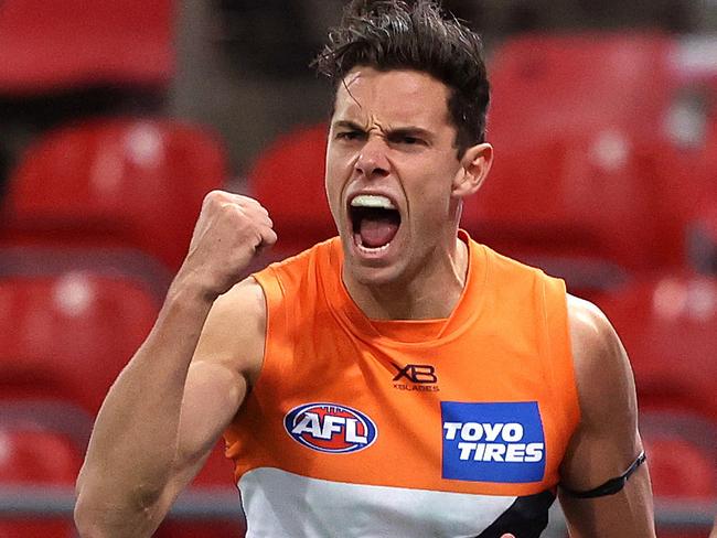 Giants Josh Kelly celebrates kicking a goal  during AFL match between the GWS Giants and Collingwood at Giants Stadium. Picture. Phil Hillyard