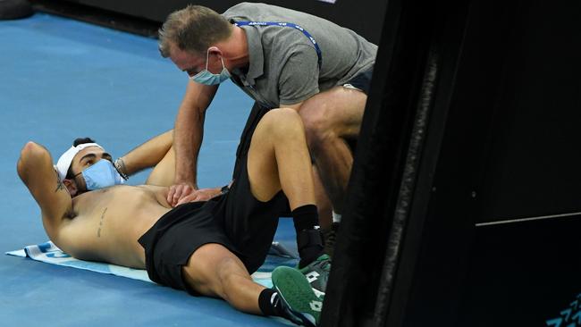 Matteo Berrettini gets treatment during his clash with Russia’s Karen Khachanov. Picture: AFP