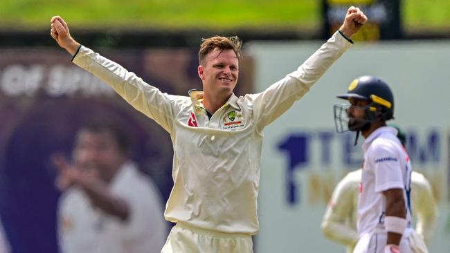 Australia's Matthew Kuhnemann celebrates after taking the wicket of Sri Lanka's captain Dhananjaya de Silva during the third day of the first Test cricket match between Sri Lanka and Australia at the Galle International Cricket Stadium in Galle on January 31, 2025. (Photo by Ishara S. KODIKARA / AFP)