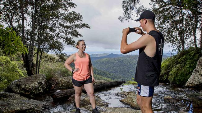 Tourism leaders are calling for the Gold Coast walking trails and Hinterland to be opened up more for eco-tourism. Jack Jeffrey and Maddy Noakes, from Geelong, at Springbrook National Park this week. Picture: Jerad Williams.