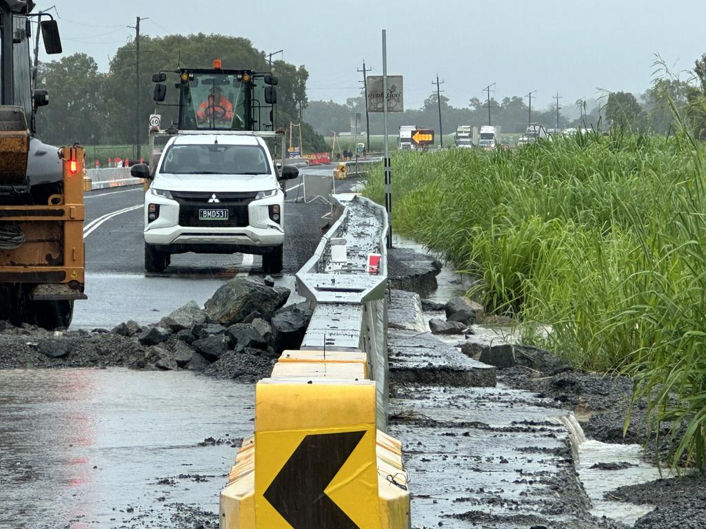 Crews work to make emergency repairs along the Bruce Highway at Calen, between Mackay and Proserpine, after heavy rain reduced it to rubble. January 14, 2023. Picture: Heidi Petith