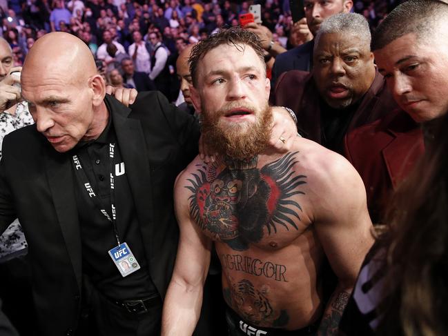 Conor McGregor is escorted from the cage area after fighting Khabib Nurmagomedov. Picture: AP Photo