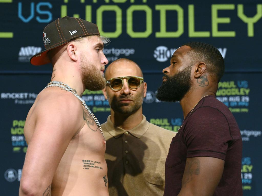 Jake Paul and Tyron Woodley pose during the press conference.