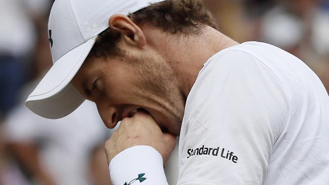 Britain's Andy Murray reacts as he loses a point to Sam Querrey.