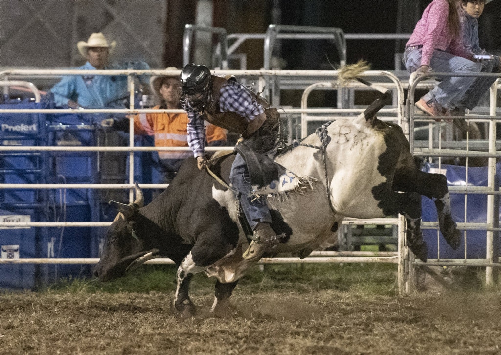 Christopher Wilson gets pushed forward at the Lawrence Twilight Rodeo. Picture: Adam Hourigan