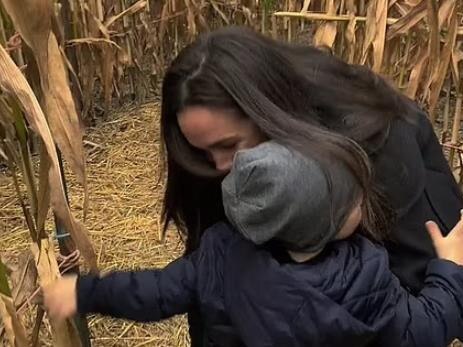 Archie runs to his mother in a corn field in previously unseen footage. Picture: Netflix