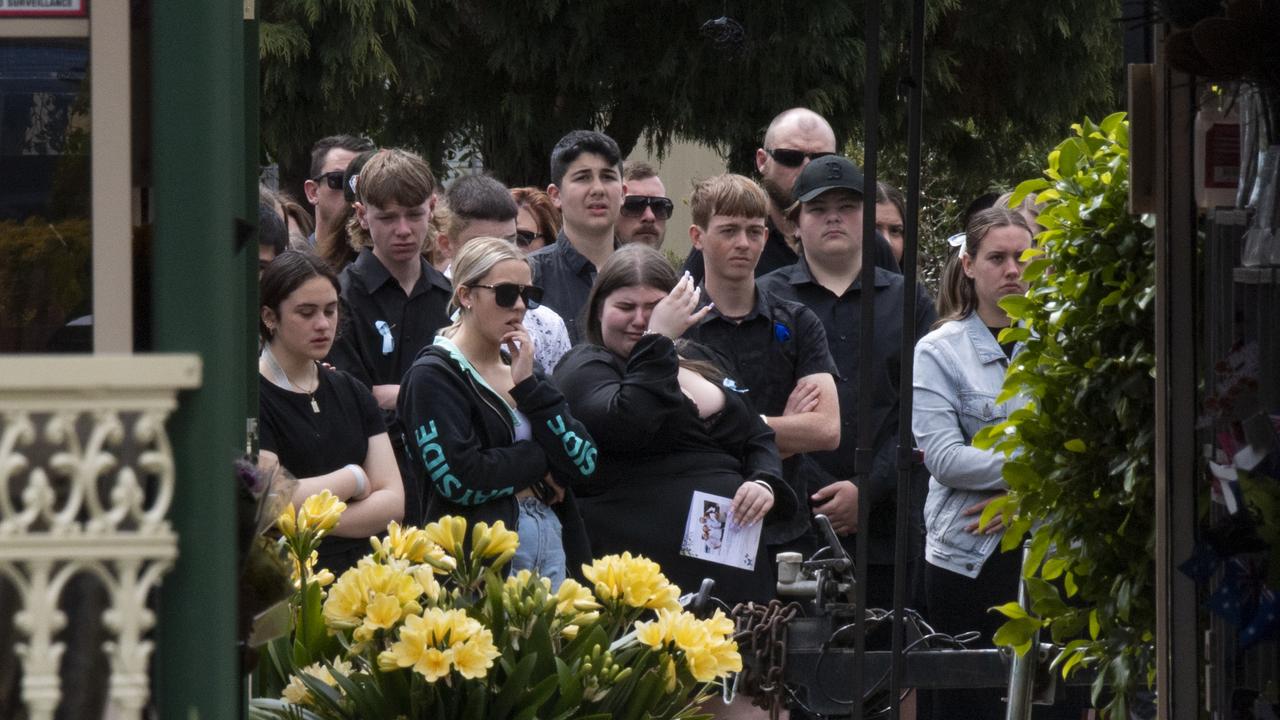 A young woman is seen breaking down after the service. Picture: NCA NewsWire / Monique Harmer