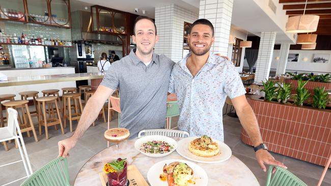 Owners TJ Cianci and Jarrod Kyle inside the venue with some dishes from the menu. Picture by Richard Gosling