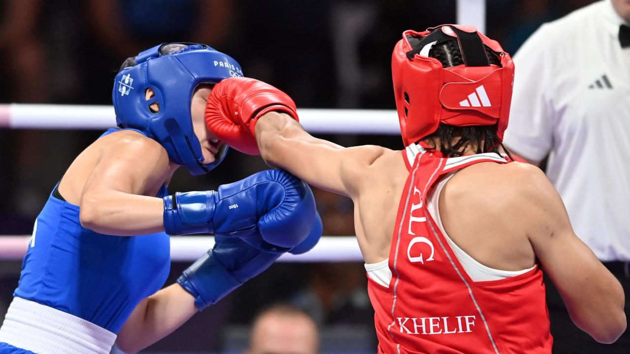 PARIS, FRANCE - AUGUST 1: Algeria's Imane Khelif (in red) during the Women's 66kg preliminary round match against Angela Carini of Italy (in blue) on day six of the Olympic Games Paris 2024 at North Paris Arena on August 01, 2024 in Paris, France. (Photo by Fabio Bozzani/Anadolu via Getty Images)