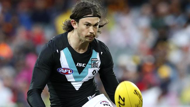 Jasper Pittard gets a kick away during Sunday’s Showdown loss to Adelaide. Picture: Sarah Reed.