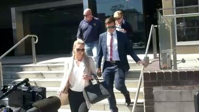James Hayes, 28, his girlfriend and his parents walk out of the Liverpool Local Court after Hayes entered a plea of not guilty to charges of indecent assault of a minor.