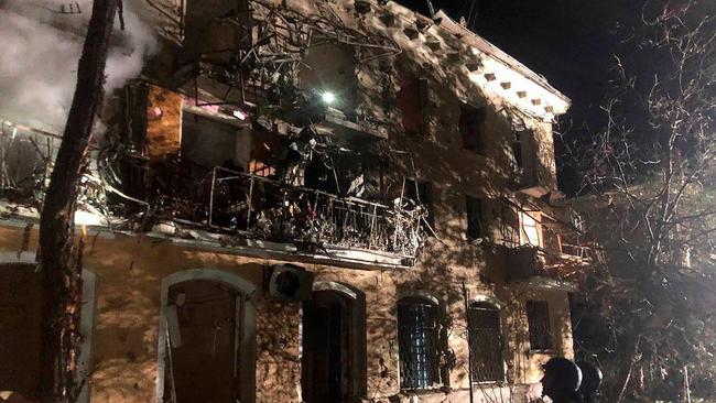 Rescuers standing close to a destroyed building, following missile strike in Zaporizhzhia, amid the Russian invasion of Ukraine. Picture: AFP