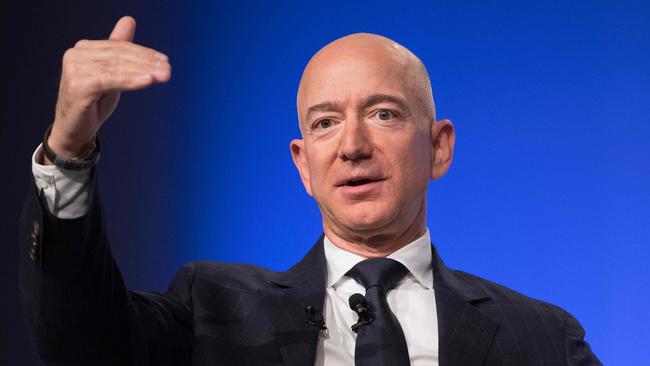 Jeff Bezos, the founder of Amazon, is the richest man in history. (Photo by Jim WATSON / AFP)