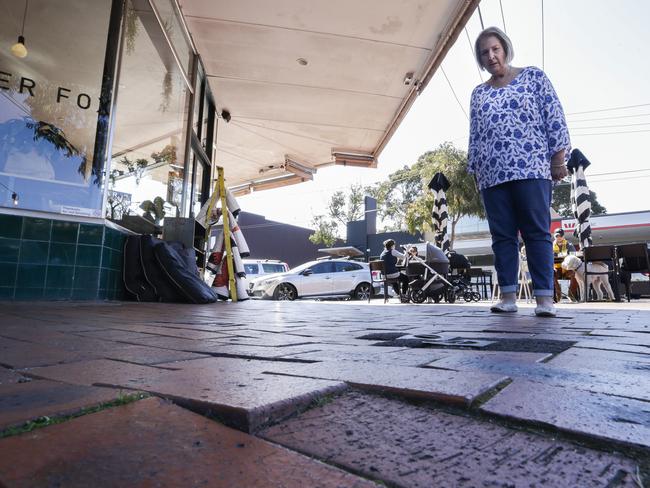 Pensioner Helen Hussain inspects the uneven part of the concourse where she fell earlier this year. Picture: Valeriu Campan