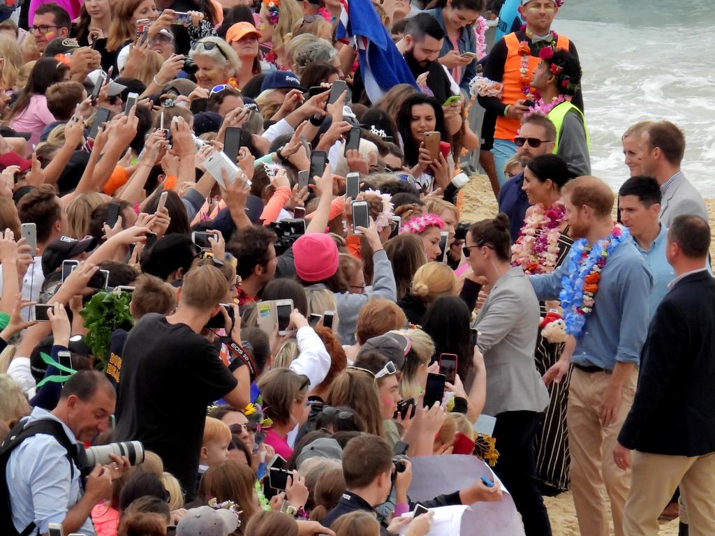 Meghan and Harry on Bondi beach meeting the locals. Picture: John Grainger