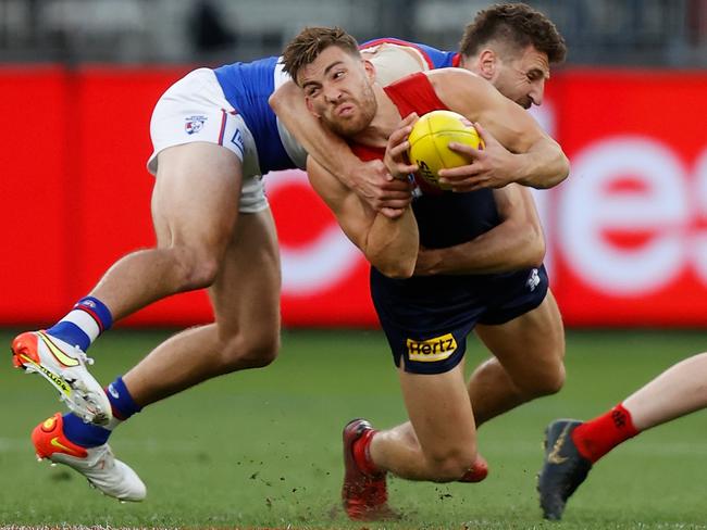 Jack Viney is tackled by Bulldogs skipper Marcus Bontempelli. Picture: Michael Willson/AFL Photos via Getty Images