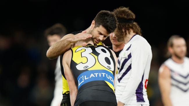 Noah Cumberland is consoled by teammate Trent Cotchin. Picture: Michael Willson/AFL Photos via Getty Images