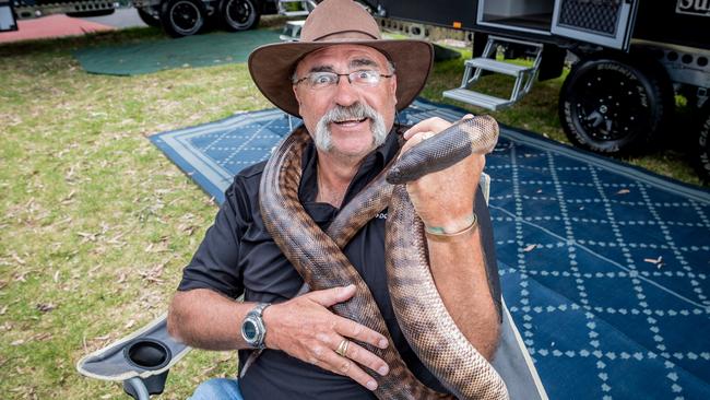 Merv Hughes meets Boofhead the a black-headed python at last year’s Victorian Camping &amp; Touring Supershow. Picture: Jake Nowakowski