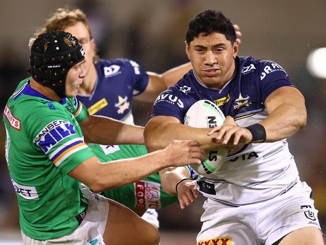 Jason Taumalolo bumps Raider Brad Schneider away. Picture: Mark Nolan/Getty Images