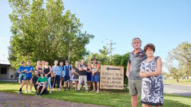 Trinity Beach residents Calvin Fergie and Shonnay Ives (front) have been fighting a Cairns Regional Council decision to demolish the house that sits directly between their homes. Picture: Romy Bullerjahn