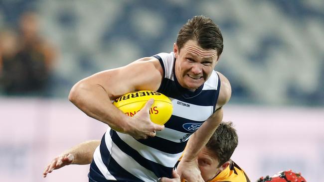 GEELONG, AUSTRALIA - JUNE 12: Patrick Dangerfield of the Geelong Cats is tackled by Liam Shiels of the Hawthorn Hawks during the 2020 AFL Round 02 match between the Geelong Cats and the Hawthorn Hawks at GMHBA Stadium on June 12, 2020 in Geelong, Australia. (Photo by Michael Willson/AFL Photos via Getty Images)