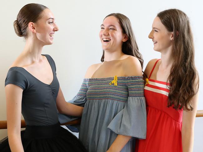 Allison Baden-Clay’s two eldest daughters Sarah, 14, (centre), and Hannah, 16, (right), with the 2018 Allison Baden-Clay Scholarship recipient Tajuddin Hennessy at Queensland Ballet Studios, West End. Picture: Liam Kidston