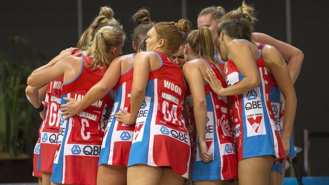 Swifts in a huddle in the second half of their match against the Thunderbirds.