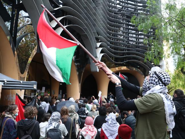 MELBOURNE, AUSTRALIA - NewsWire Photos, MAY 17, 2024. Pro Palestine protesters continue to occupy the Arts Building at Melbourne University. Students gather to listen to a press conference outside the building.  Picture: NewsWire / David Crosling