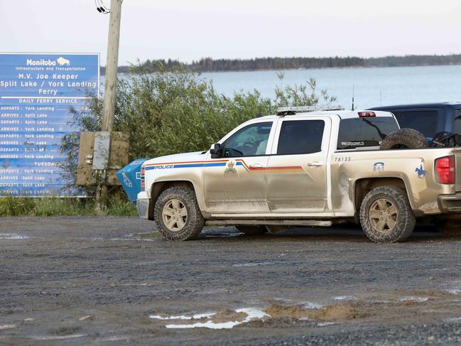 Police waiting to get onto the boat at Split Lake to York Landing at first light. Picture: Clint Brewer