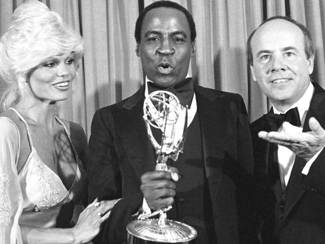 Robert Guillaume accepts his Emmy Award for best supporting actor in Soap from Tim Conway, right, and Loni Anderson at the 31st Emmy Awards in Los Angeles.