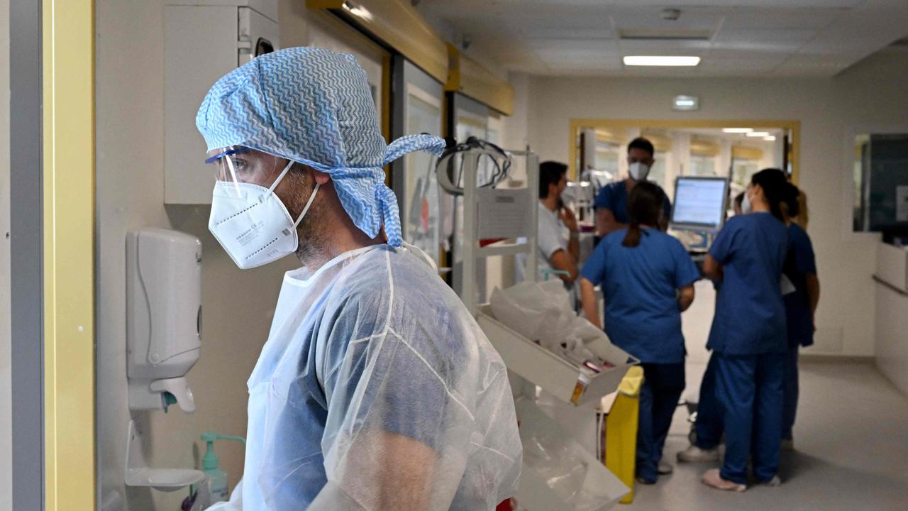 A nurse prepares to take care of a patient infected with the Covid-19. Picture: Nicolas Tucat/AFP