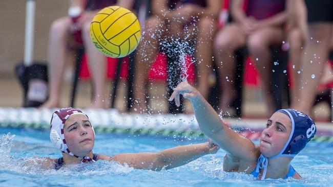 Action from the Water Polo 15&U and 17&U Female National State Championships at the Gold Coast Aquatic Centre, Southport, on Tuesday 27 September 2022.  15&U Gold  medal game match between QLD Maroon and NSW Blues.  QLD's #2  Elyanna Astone and NSW's  #8 Saskia Dunn.  Picture: Jerad Williams