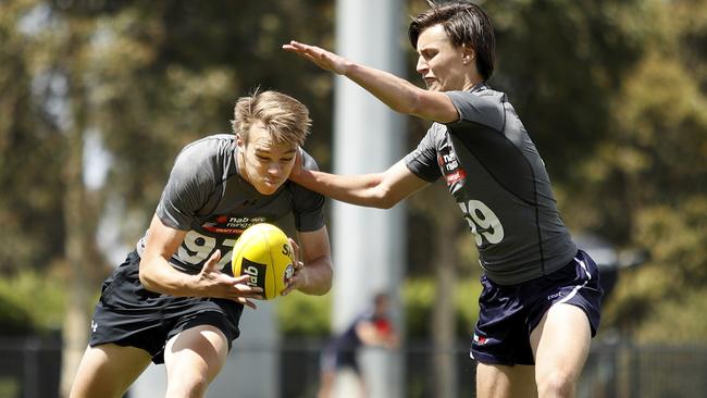 Matthew Allison competes against Lachlan Carrigan.