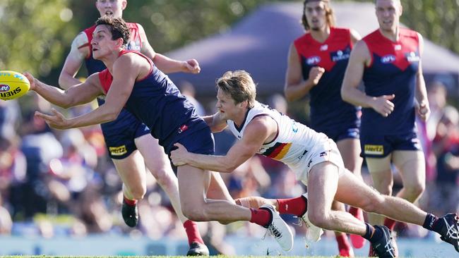 Rory Sloane tackles Sam Weideman during the first half. Picture: AAP Image/Michael Dodge