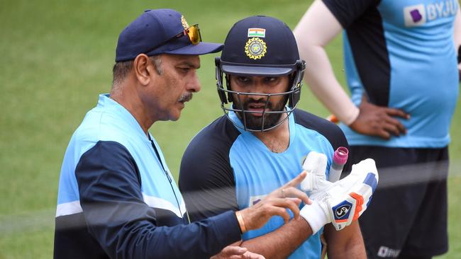 India's Rohit Sharma (R) with team coach Ravi Shastri (L), both of whom would have attended the fake dinner. Picture: William West/AFP