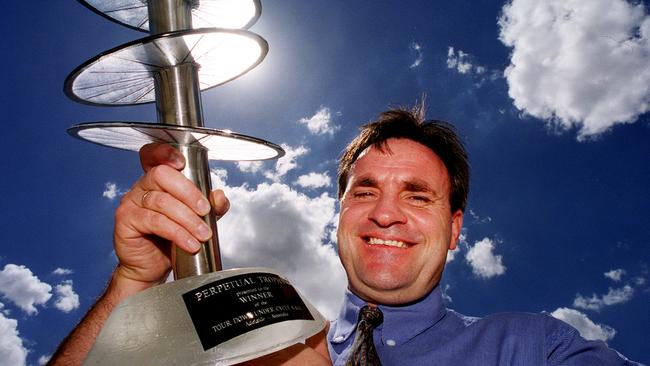 Tour Down Under race director Mike Turtur holding the 1999 TDU trophy.