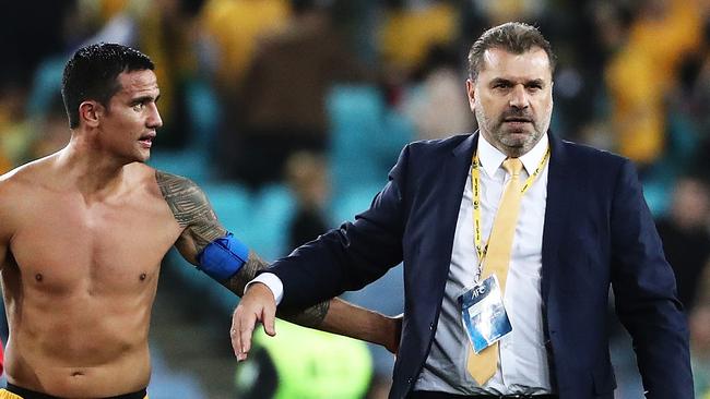 Socceroos coach Ange Postecoglou with striker Tim Cahill after Australia beat Syria 2-1 in their World Cup playoff on Tuesday night.