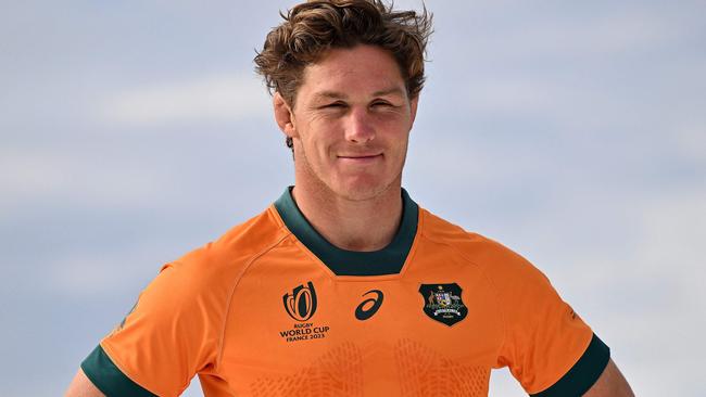 (FILES) Australiaâs Michael Hooper poses during the 2023 Rugby World Cup jersey launch media event in Sydney on June 22, 2023. Michael Hooper, who holds the record for the most caps as Australia captain, put an end to his international rugby career on June 30, 2024, after missing out on selection for the Paris Olympics.  The 32-year-old, who played 125 Tests for the Wallabies - 69 of them as skipper - announced his immediate retirement on social media. (Photo by Saeed KHAN / AFP) / -- IMAGE RESTRICTED TO EDITORIAL USE - STRICTLY NO COMMERCIAL USE --