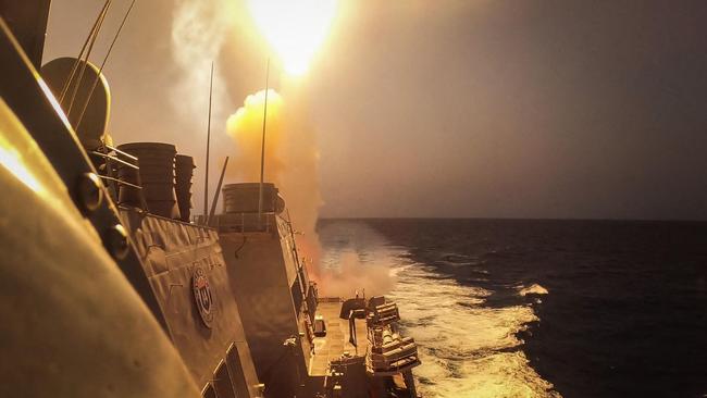 The Arleigh Burke-class guided-missile destroyer USS Carney (DDG 64) defeating a combination of Houthi missiles and unmanned aerial vehicles in the Red Sea. Picture: US Navy/AFP.