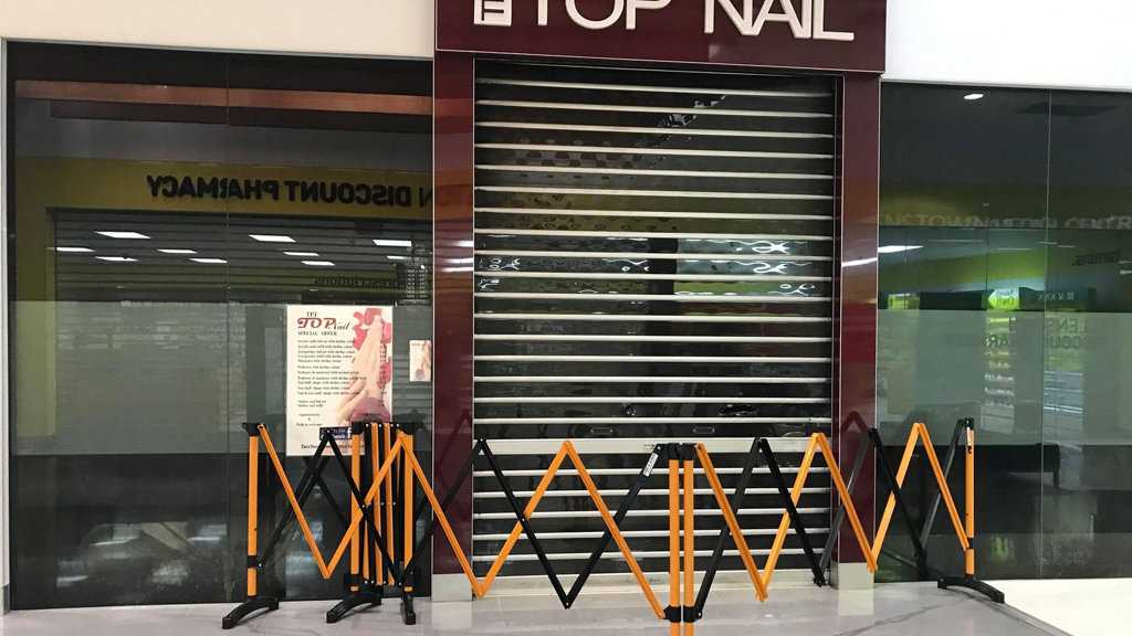 Ash covered the windows of the Top Nail Allenstown store after a fire on Thursday night. Picture: vanessa jarrett